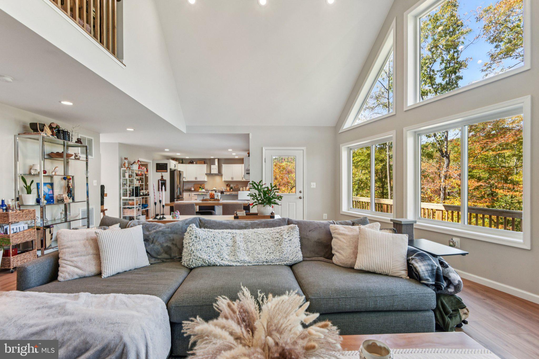 490 Black Twig Road Linden, VA 22642 - Photo 11 of 67 a living room with furniture and a large window