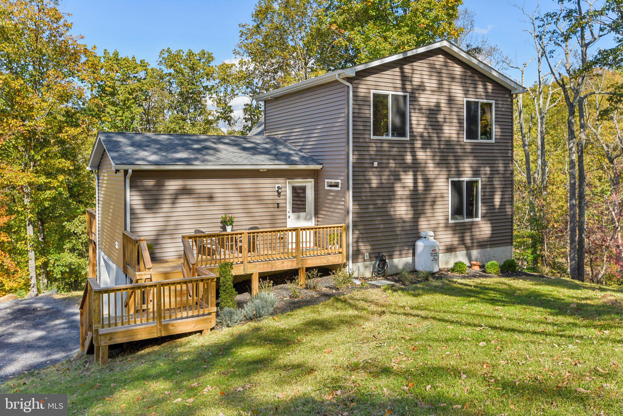 490 Black Twig Road Linden, VA 22642 - Photo 2 of 67 a front view of a house with a yard