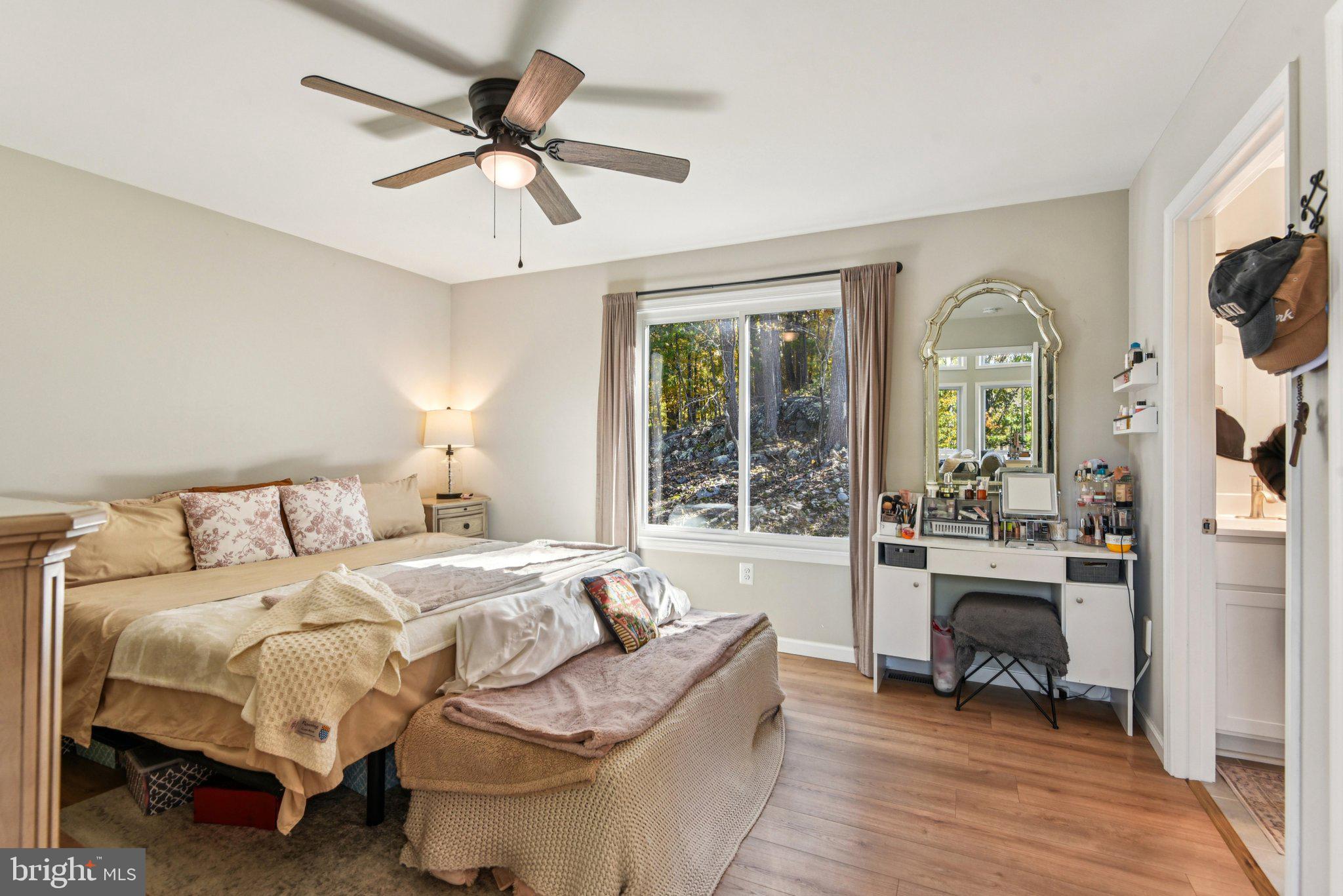 490 Black Twig Road Linden, VA 22642 - Photo 23 of 67 a spacious bedroom with a bed and a large window