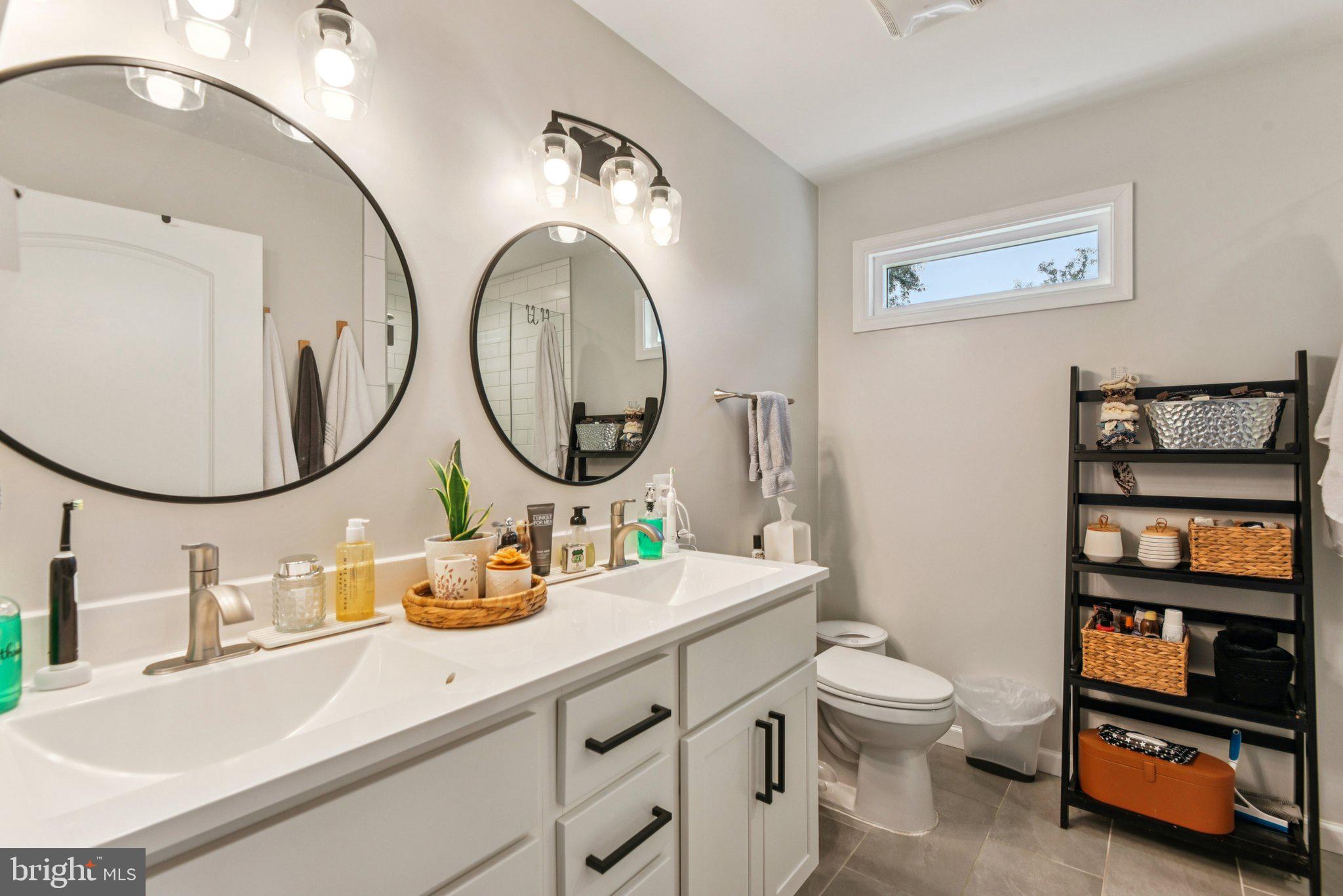 490 Black Twig Road Linden, VA 22642 - Photo 27 of 67 a bathroom with a sink mirror and a toilet