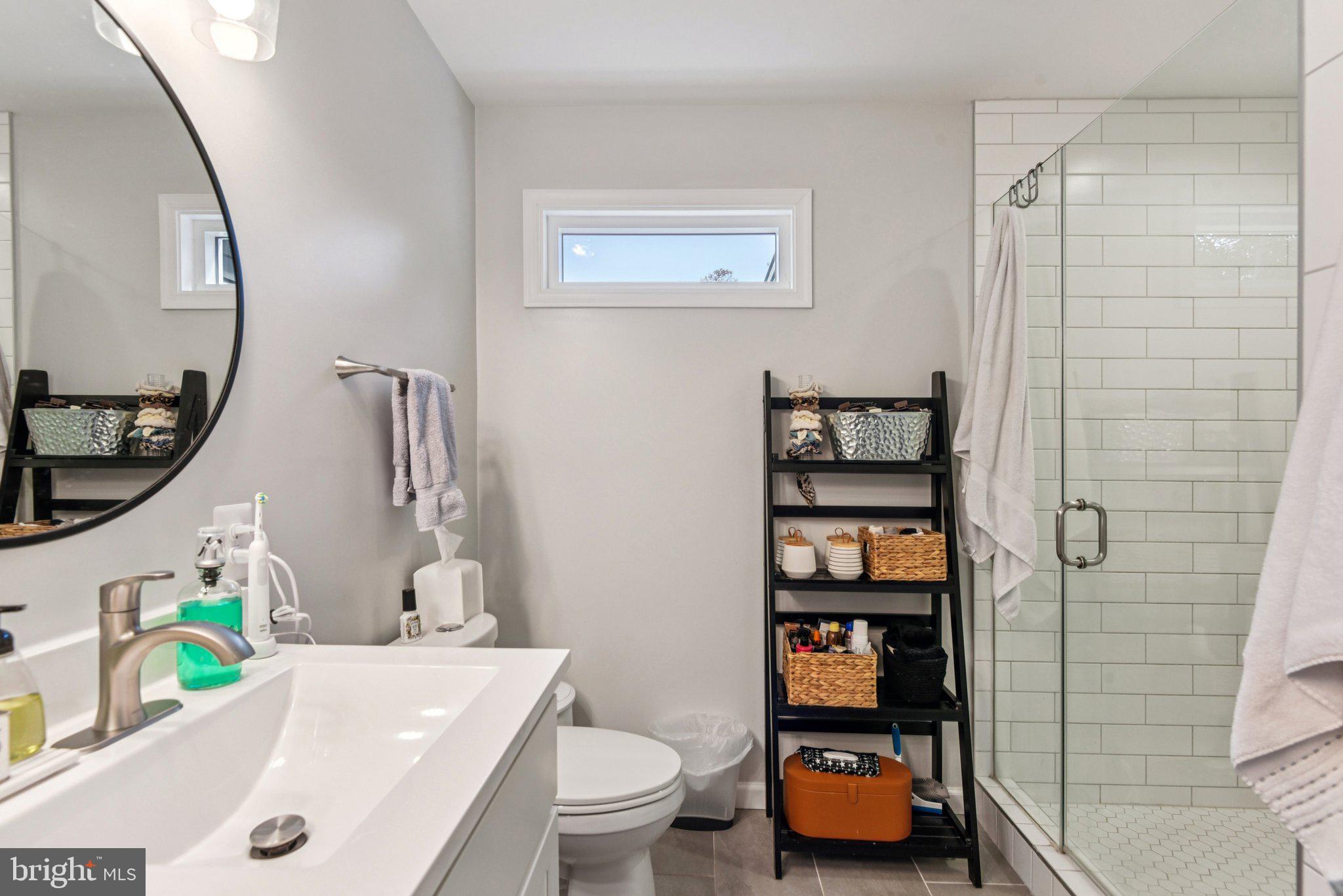 490 Black Twig Road Linden, VA 22642 - Photo 28 of 67 a bathroom with a toilet sink and shower