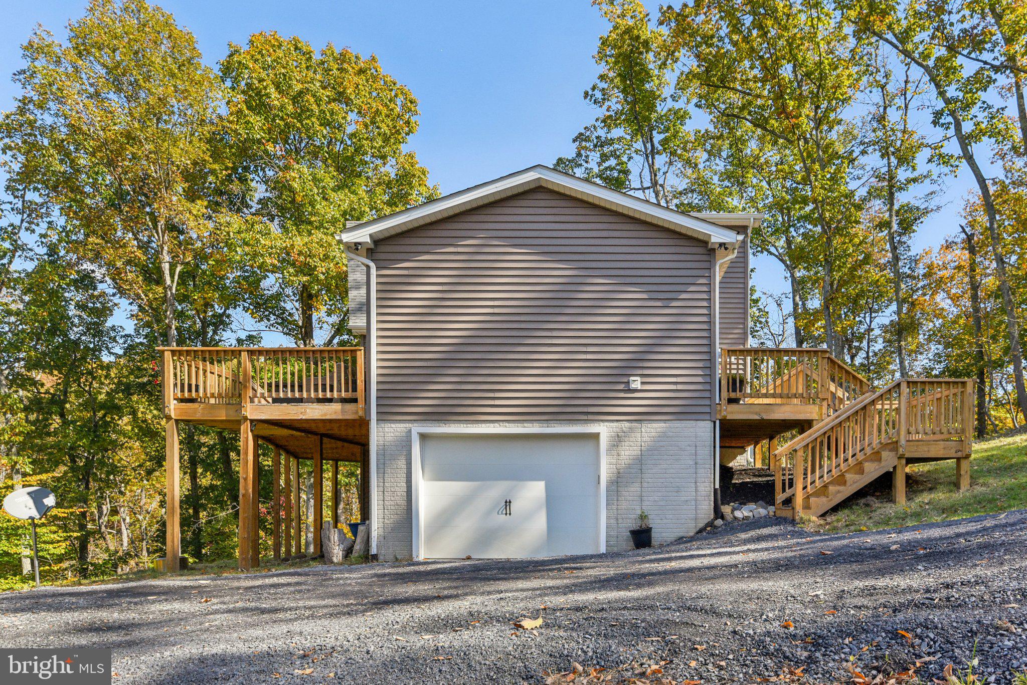 490 Black Twig Road Linden, VA 22642 - Photo 5 of 67 a view of a house with a garage