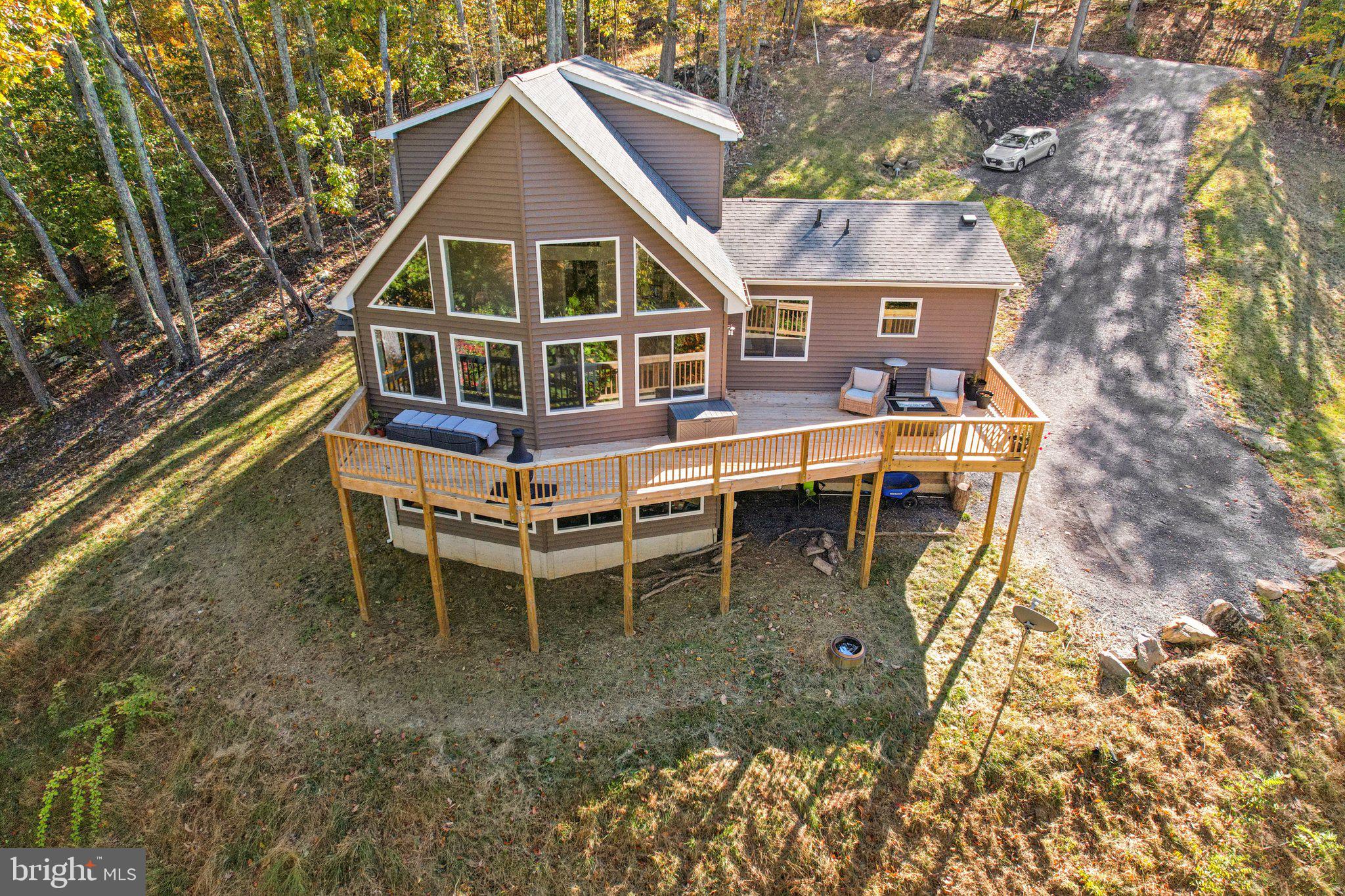 490 Black Twig Road Linden, VA 22642 - Photo 61 of 67 a wooden bench sitting in front of a house