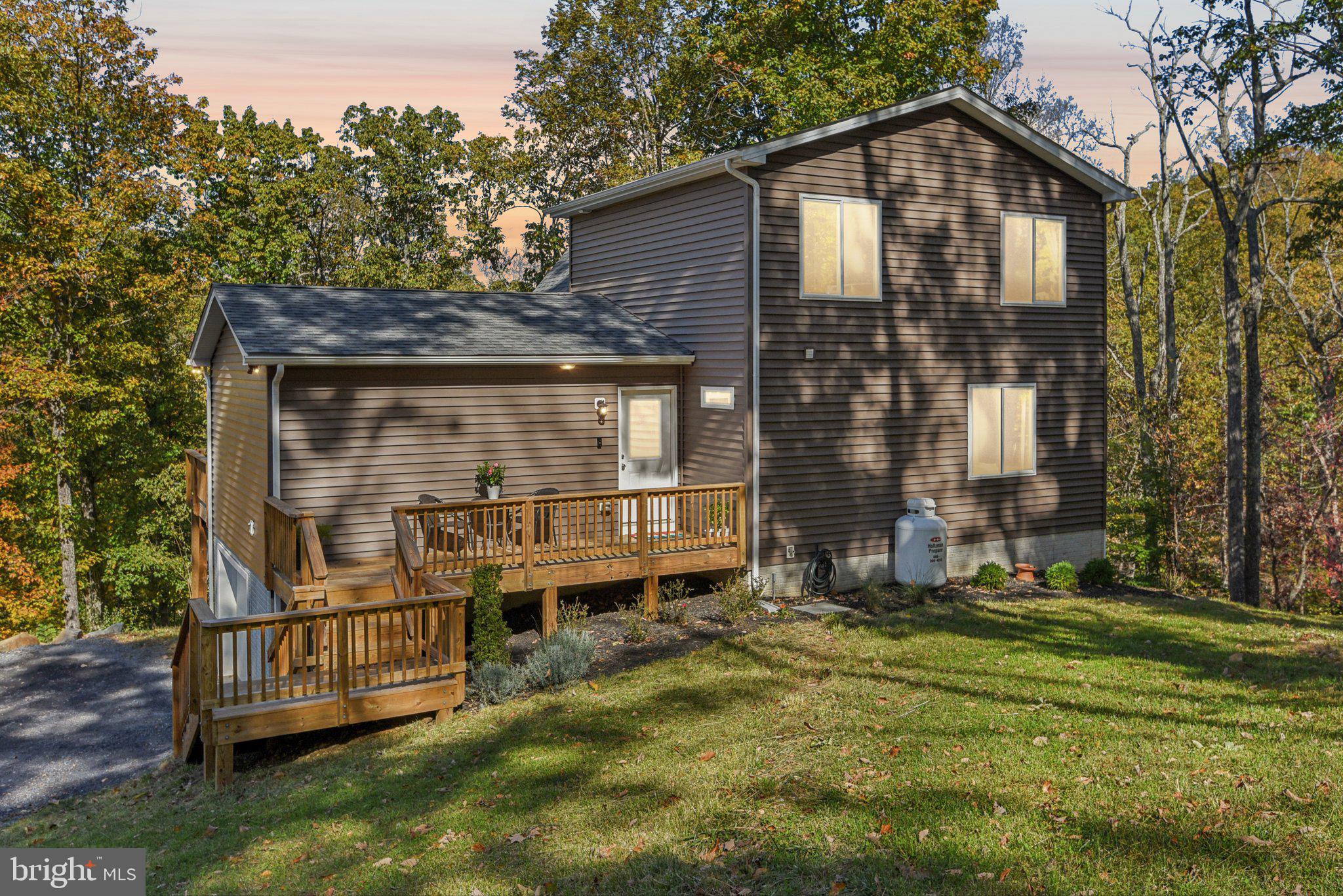 490 Black Twig Road Linden, VA 22642 - Photo 66 of 67 a front view of a house with a yard