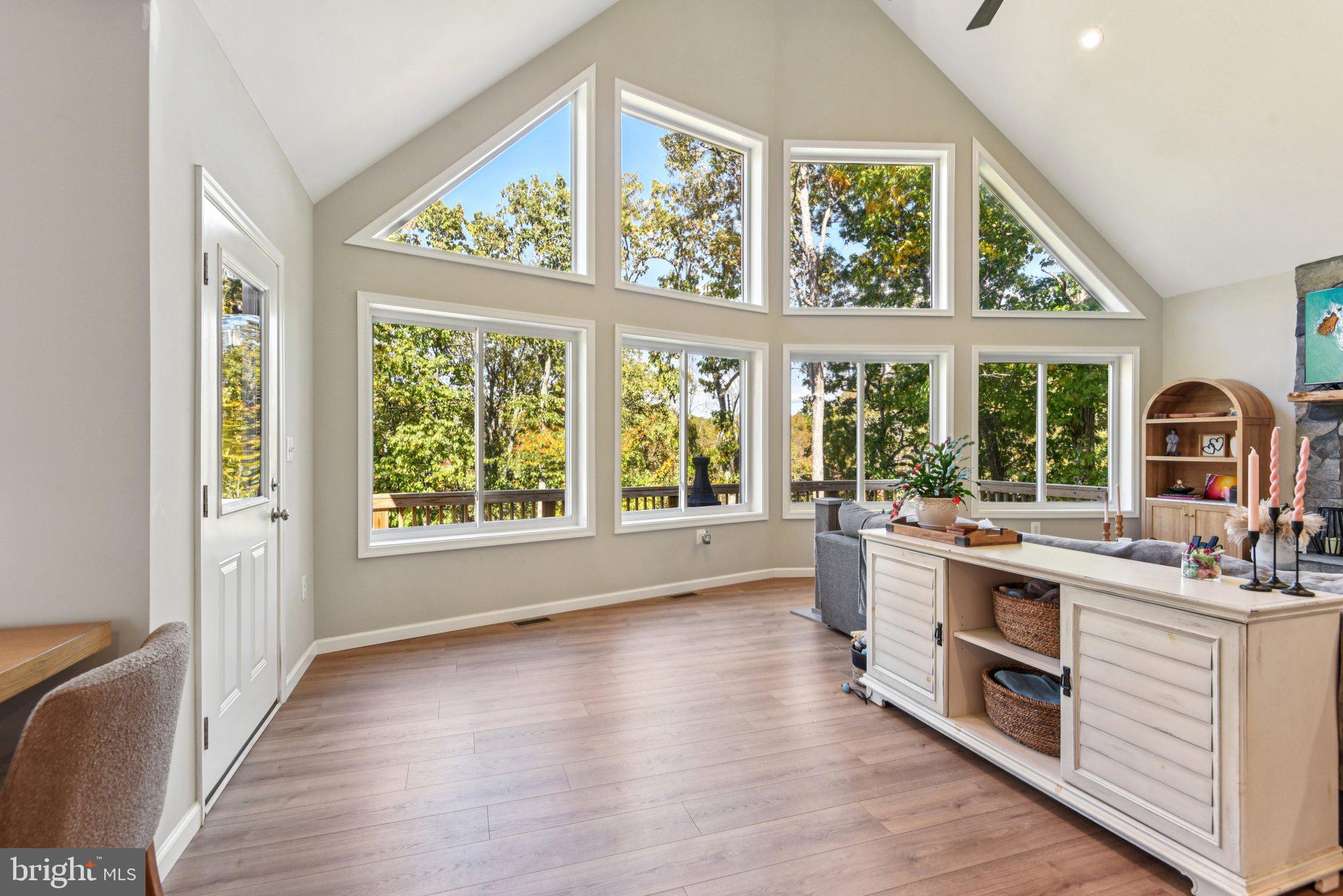 490 Black Twig Road Linden, VA 22642 - Photo 7 of 67 a kitchen with stainless steel appliances a stove a sink and wooden cabinets