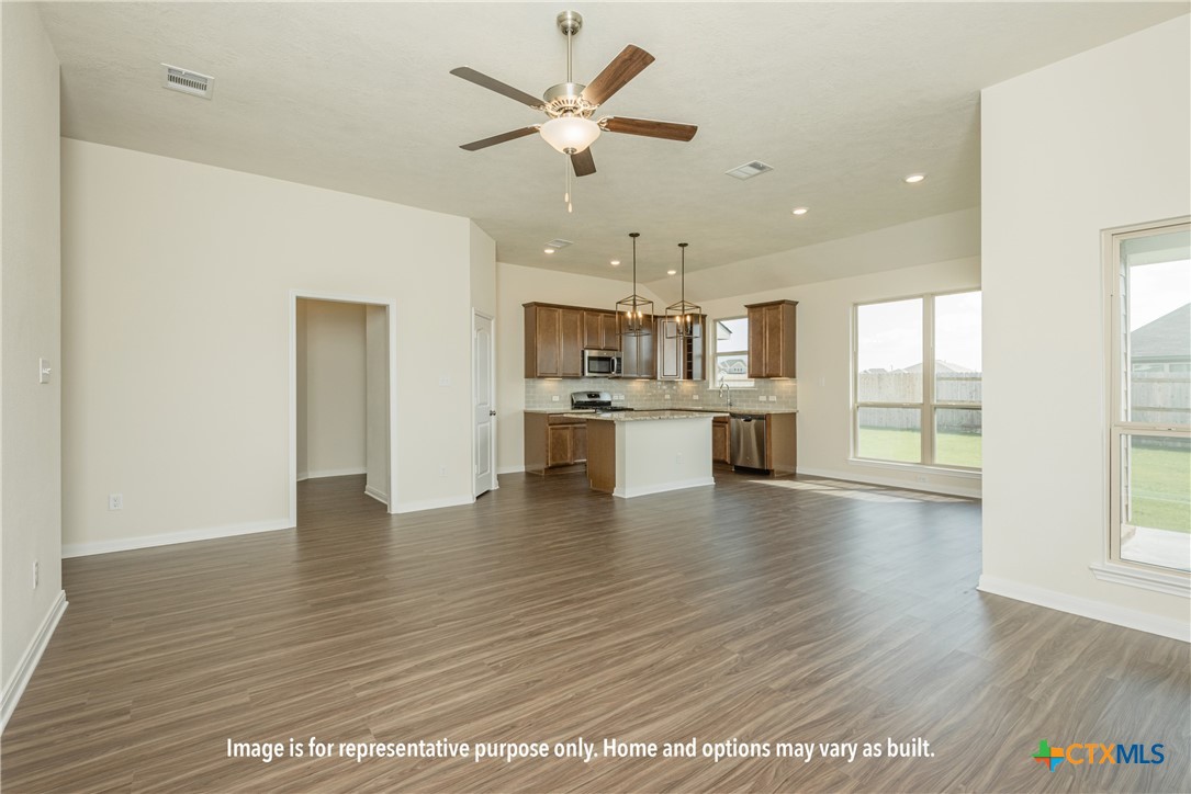 375 Pathfinder Drive Copperas Cove, TX 76522 - Photo 4 of 7 a view of an empty room with kitchen appliances and a ceiling fan