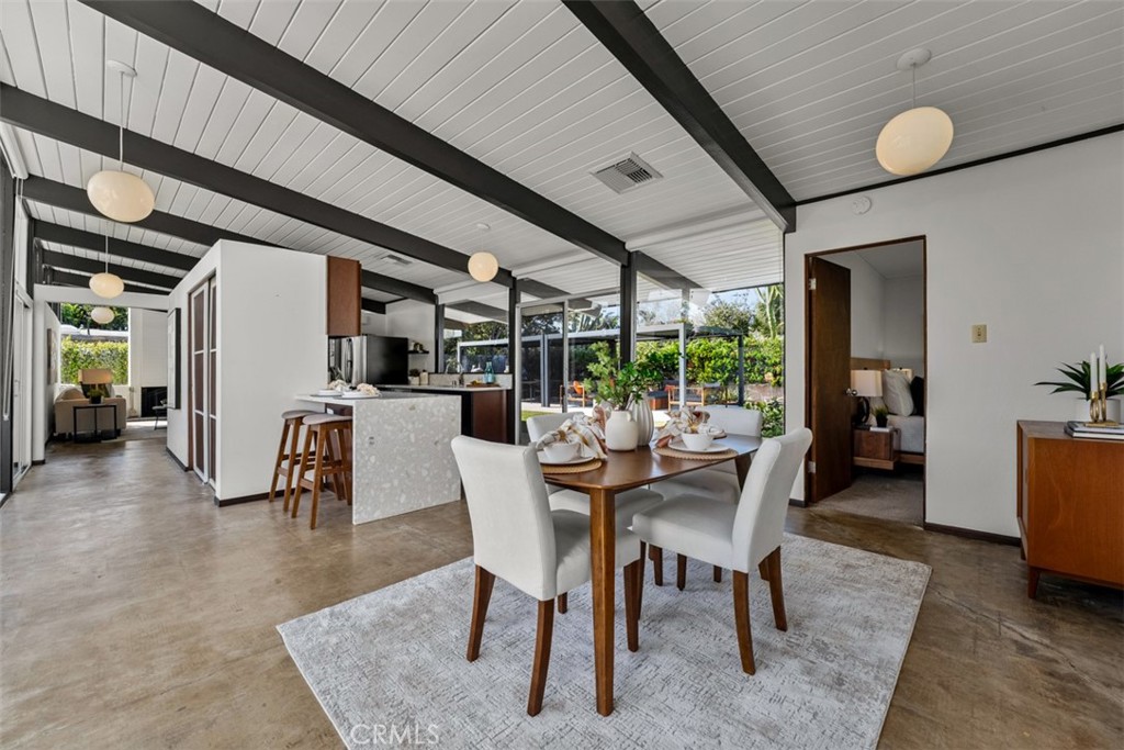 1830 North Ridgewood Street Orange, CA 92865 - Photo 13 of 29 a dining room with furniture and a floor to ceiling window