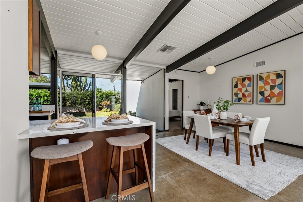 1830 North Ridgewood Street Orange, CA 92865 - Photo 19 of 29 a dining room with furniture a rug and a large window
