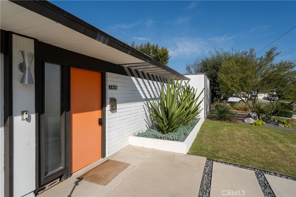 1830 North Ridgewood Street Orange, CA 92865 - Photo 3 of 11 The home can be entered thru the direct-access two-car garage, or through the front door that enters the classic open-air foyer.