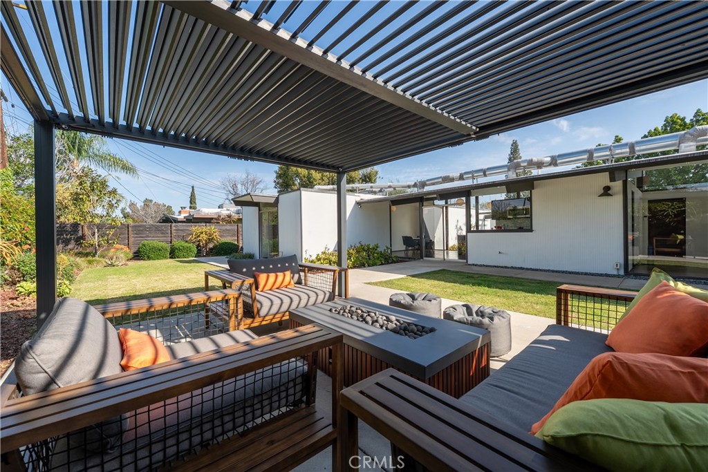 1830 North Ridgewood Street Orange, CA 92865 - Photo 7 of 11 Pergola with adjustable louvres shown partially opened. Built-in fire pit.