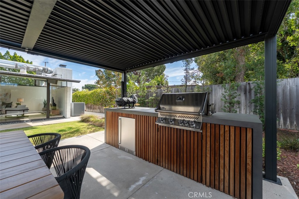 1830 North Ridgewood Street Orange, CA 92865 - Photo 9 of 29 a view of a chairs and table in the patio