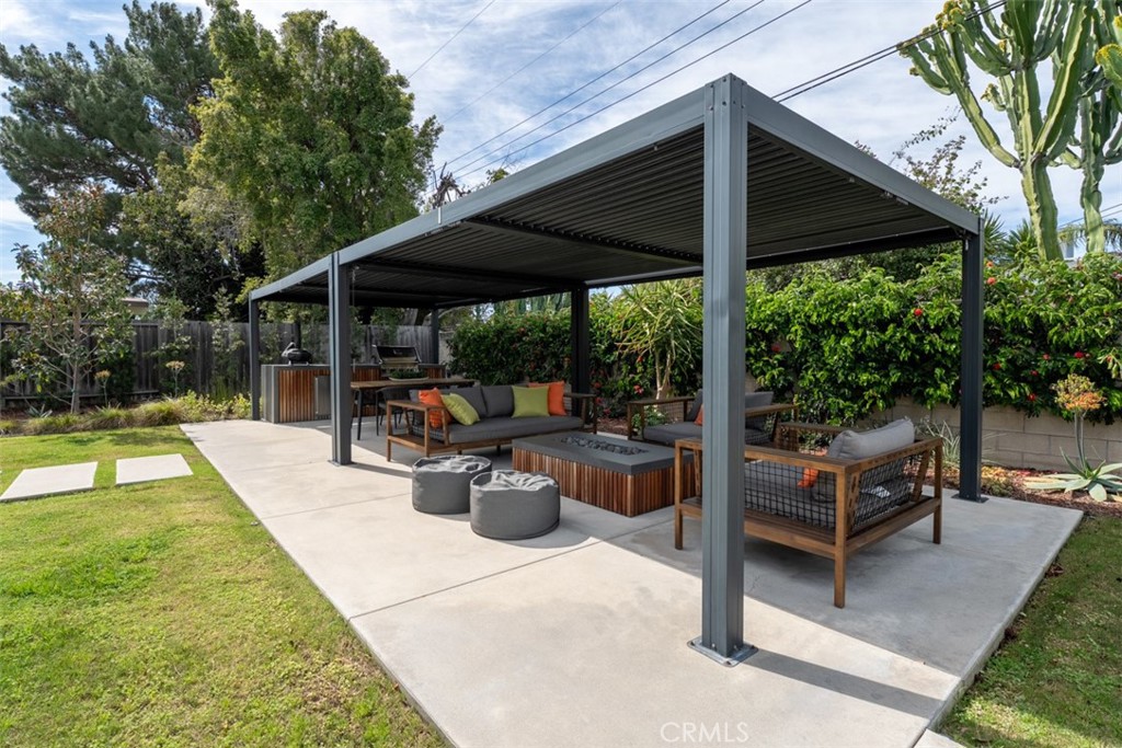 1830 North Ridgewood Street Orange, CA 92865 - Photo 10 of 29 a view of a patio with a table and chairs