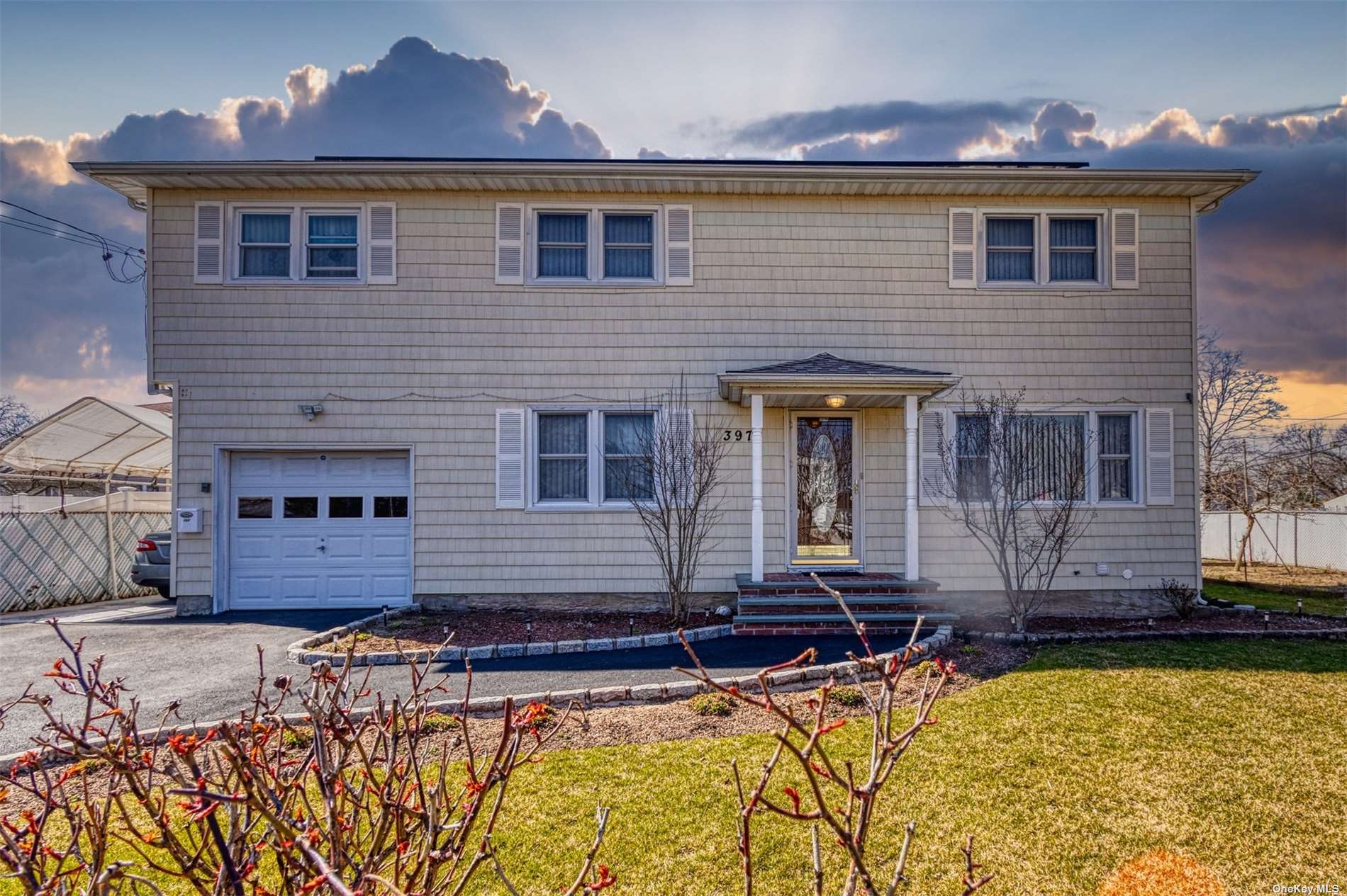 a view of a house with swimming pool and sitting area