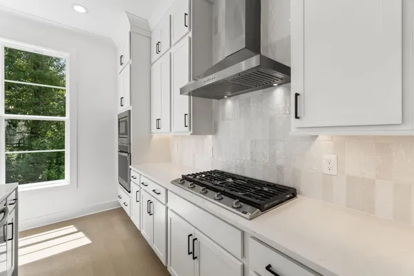 a bathroom with a sink and cabinets