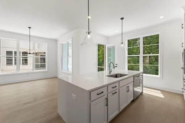 an empty room with a empty space and windows