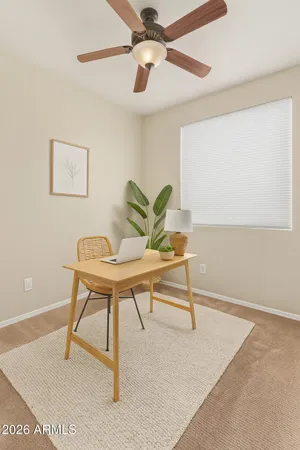 a view of a workspace with furniture