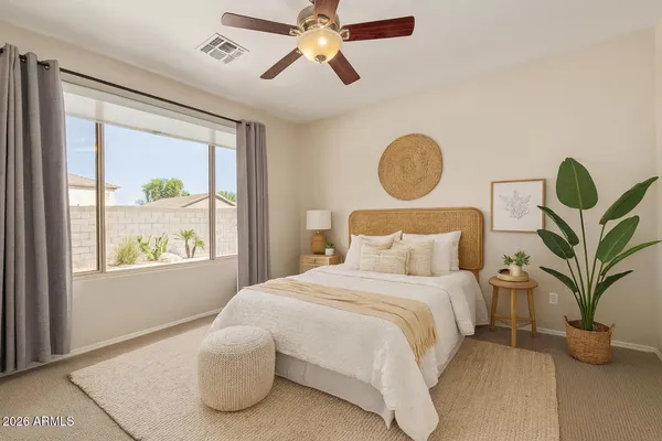 a bedroom with bed and window