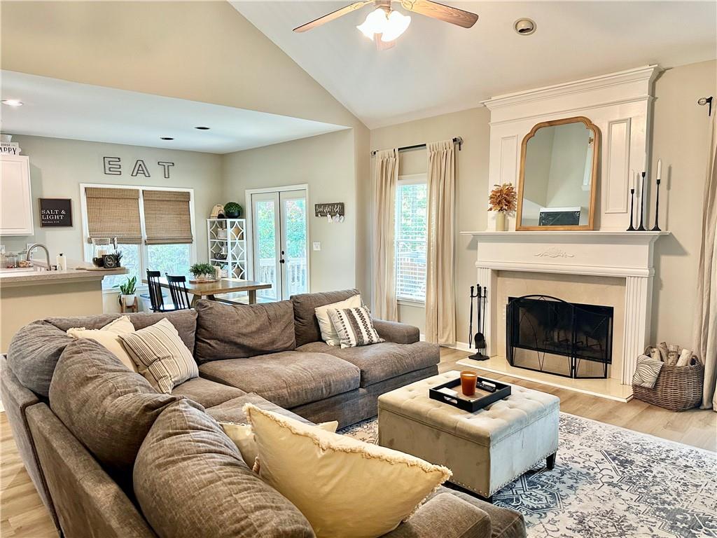 2533 Gold Hill Court Villa Rica, GA 30180 - Photo 19 of 46 a living room with furniture a fireplace and a flat screen tv