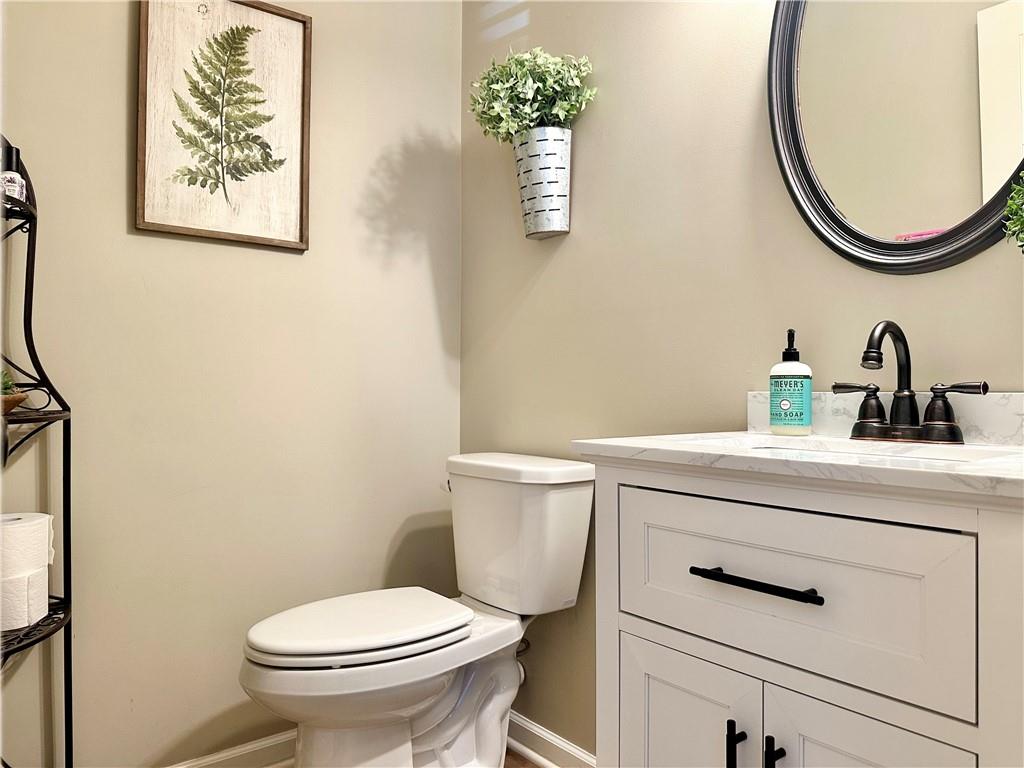 2533 Gold Hill Court Villa Rica, GA 30180 - Photo 20 of 46 a bathroom with a toilet a sink and a mirror