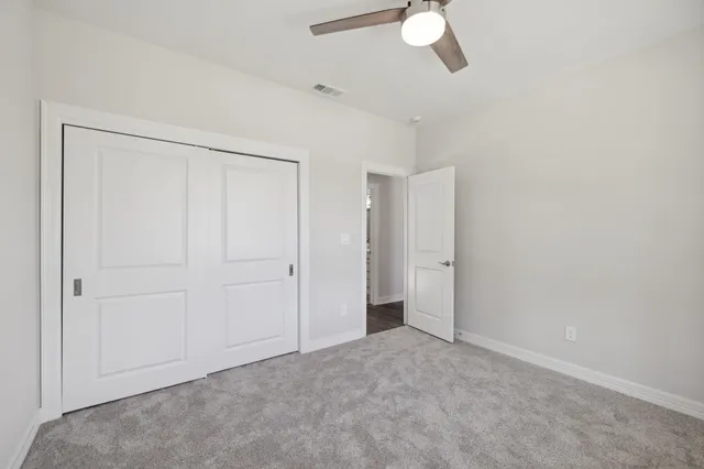a view of a livingroom with a ceiling fan