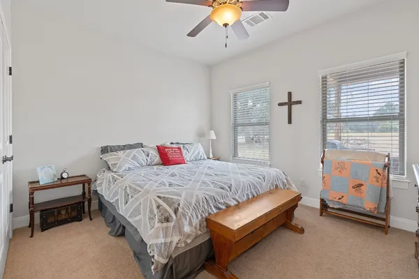a bedroom with a bed and window