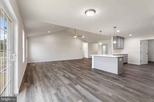 a view of kitchen and kitchen with wooden floor