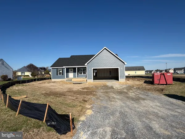 a front view of a house with yard