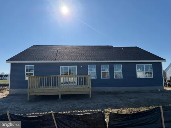 a view of house with a yard