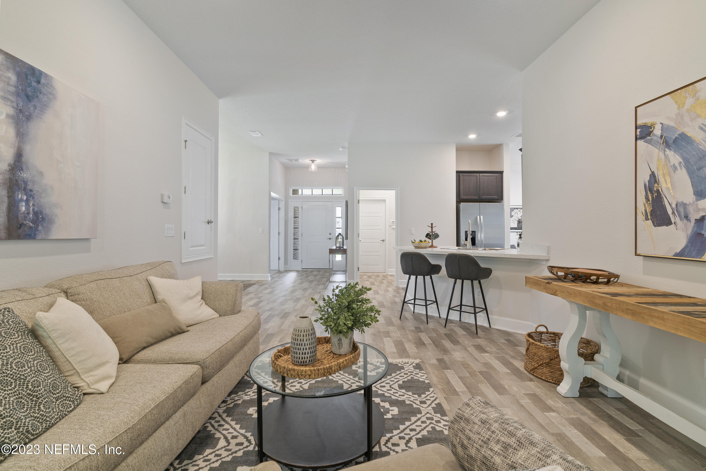 7833 Driggers Street Jacksonville, FL 32220 - Photo 11 of 26 a living room with furniture and a potted plant