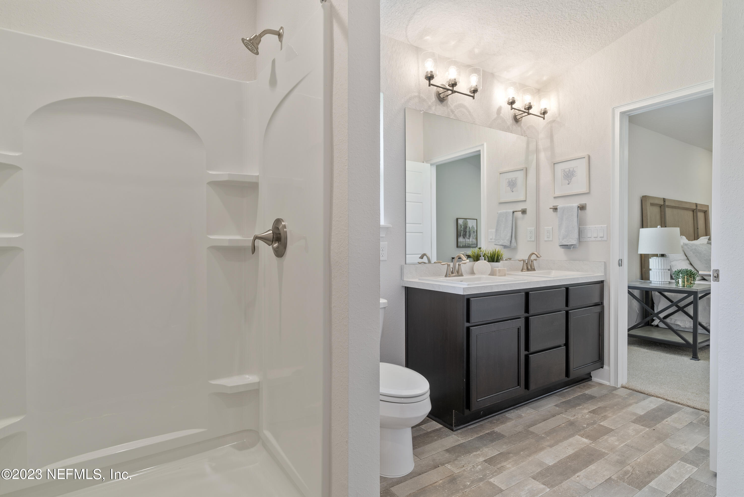7833 Driggers Street Jacksonville, FL 32220 - Photo 15 of 26 a bathroom with a sink a toilet and shower