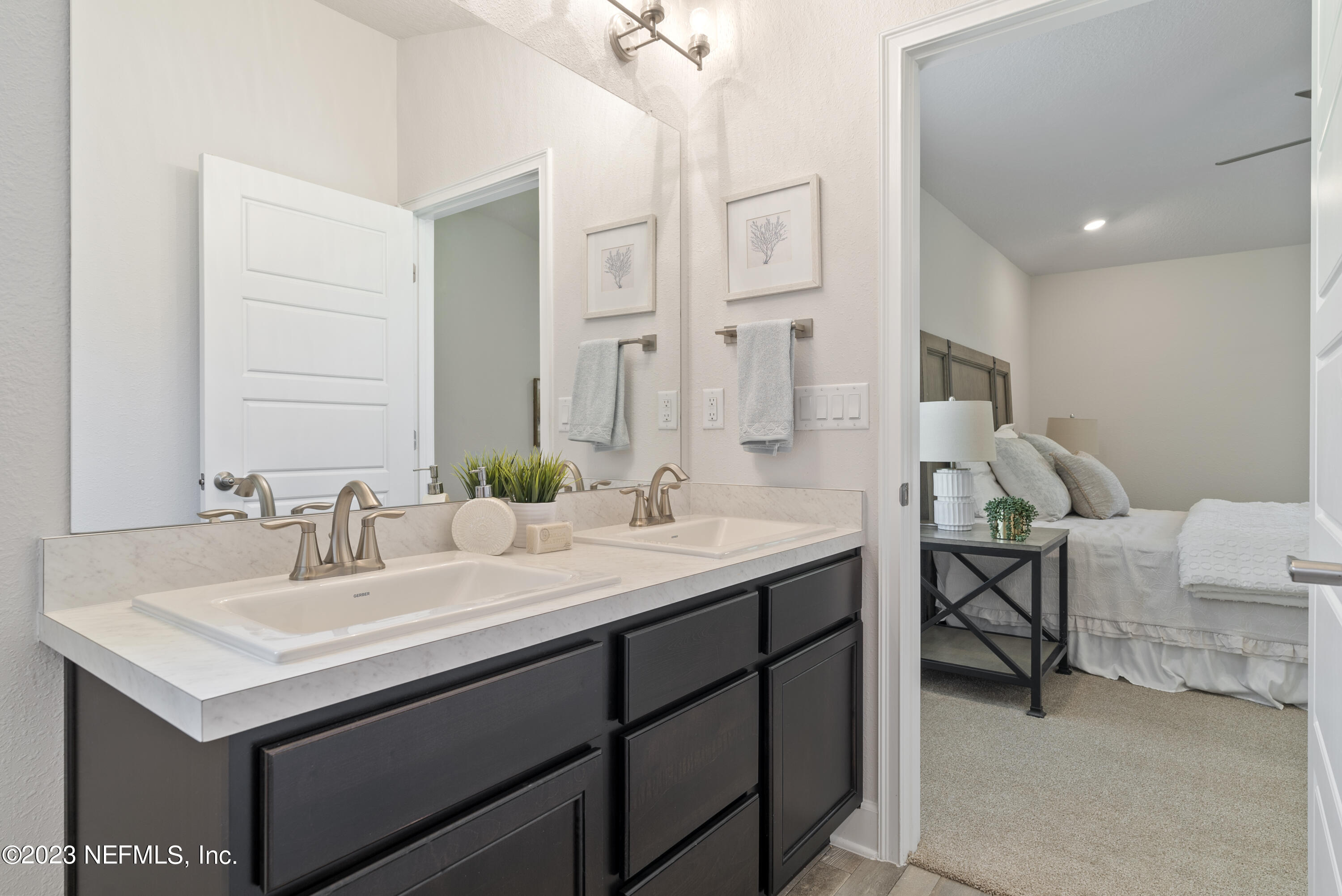 7833 Driggers Street Jacksonville, FL 32220 - Photo 16 of 26 a bathroom with a sink and a mirror