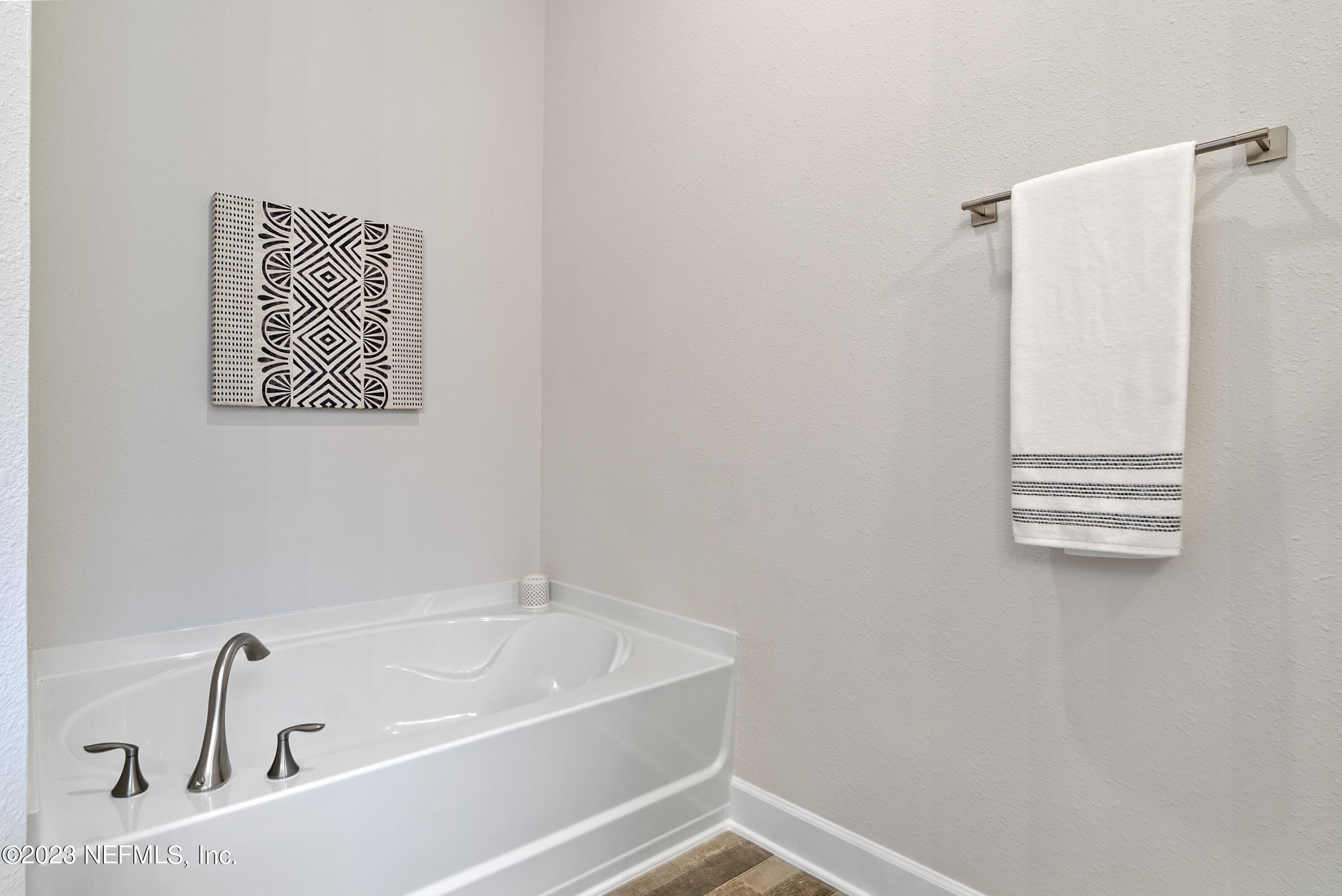 7833 Driggers Street Jacksonville, FL 32220 - Photo 17 of 26 a bathroom with a bathtub and shower
