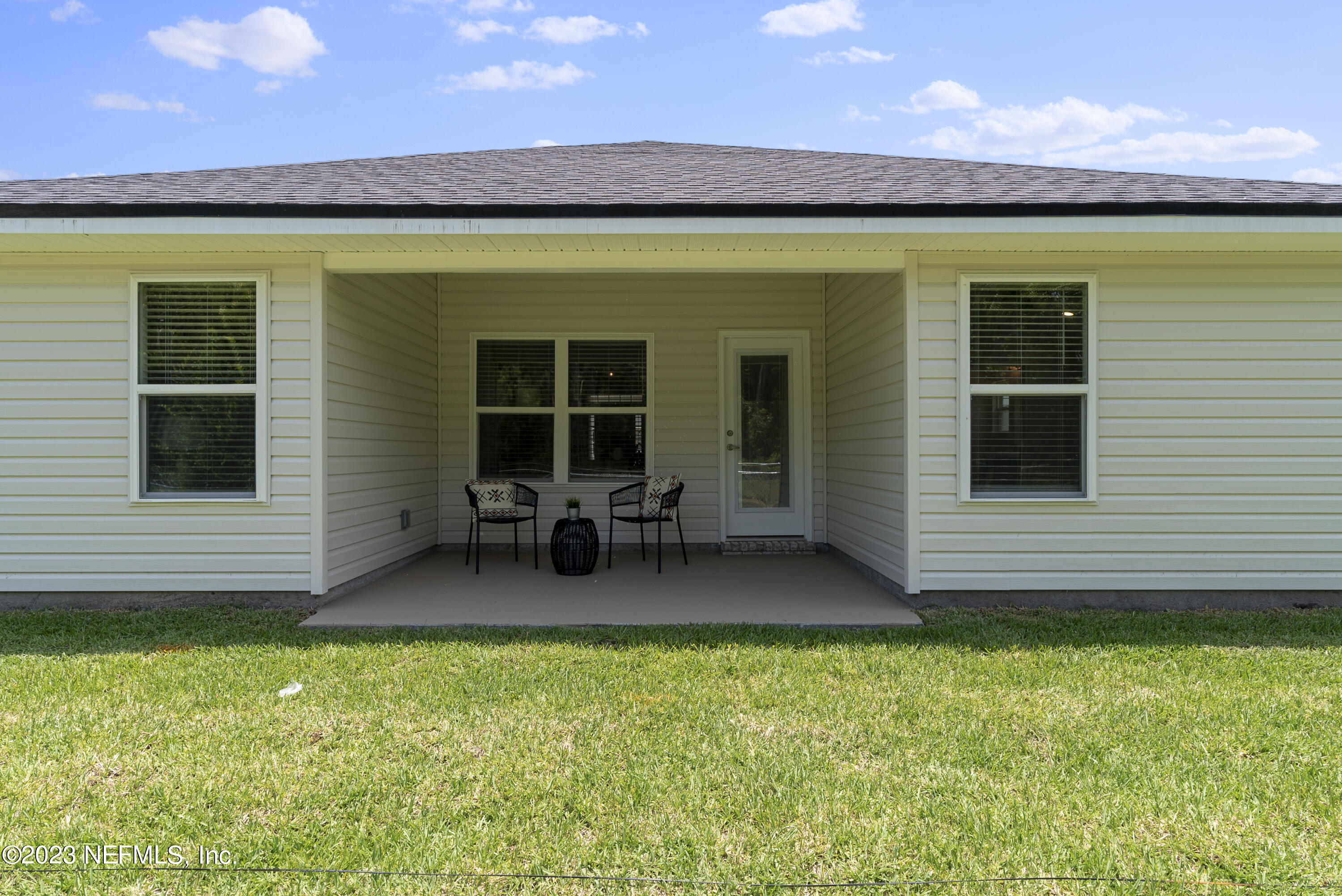 7833 Driggers Street Jacksonville, FL 32220 - Photo 21 of 26 a view of a house with porch and wooden floor