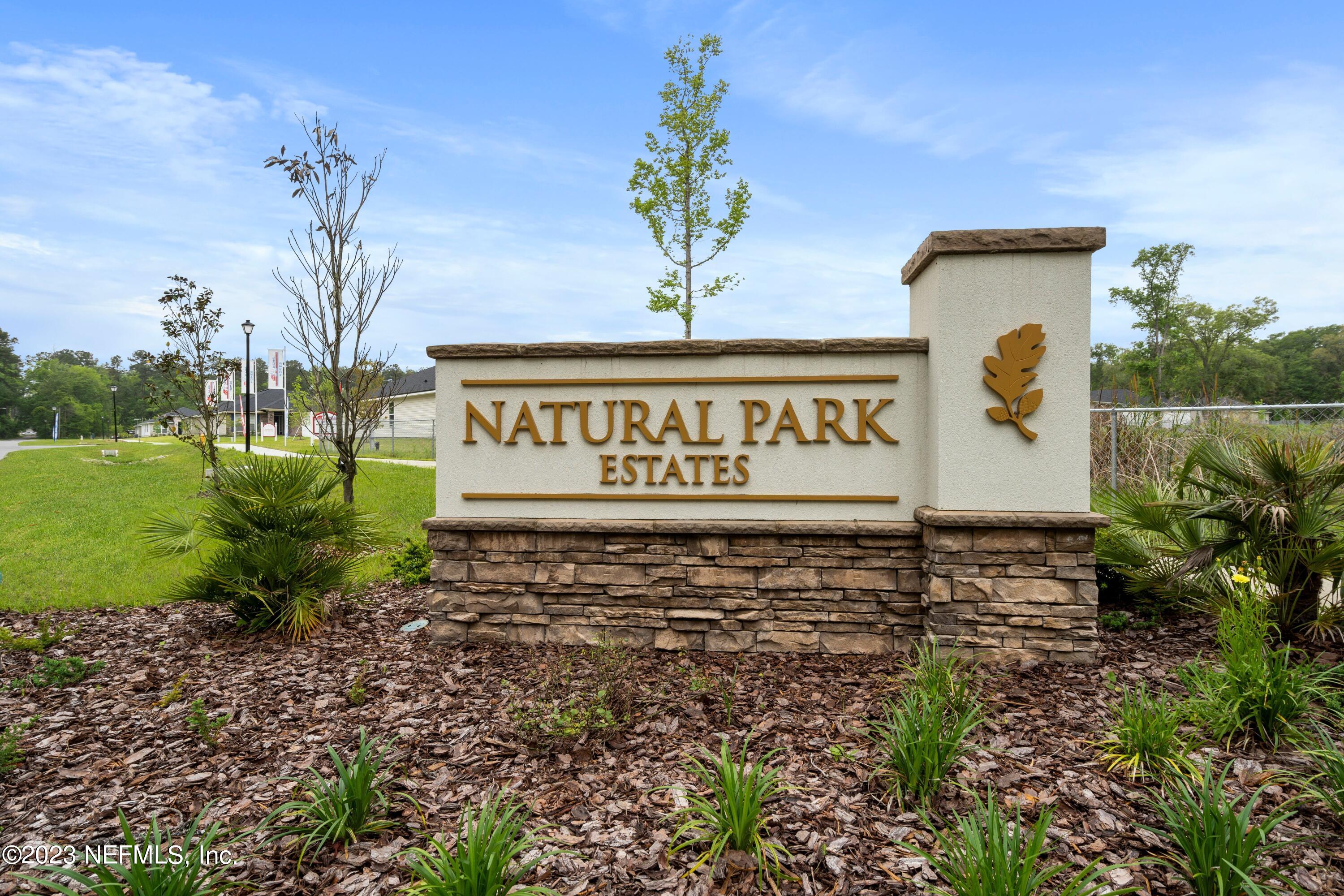 7833 Driggers Street Jacksonville, FL 32220 - Photo 23 of 26 a sign on the side of the road
