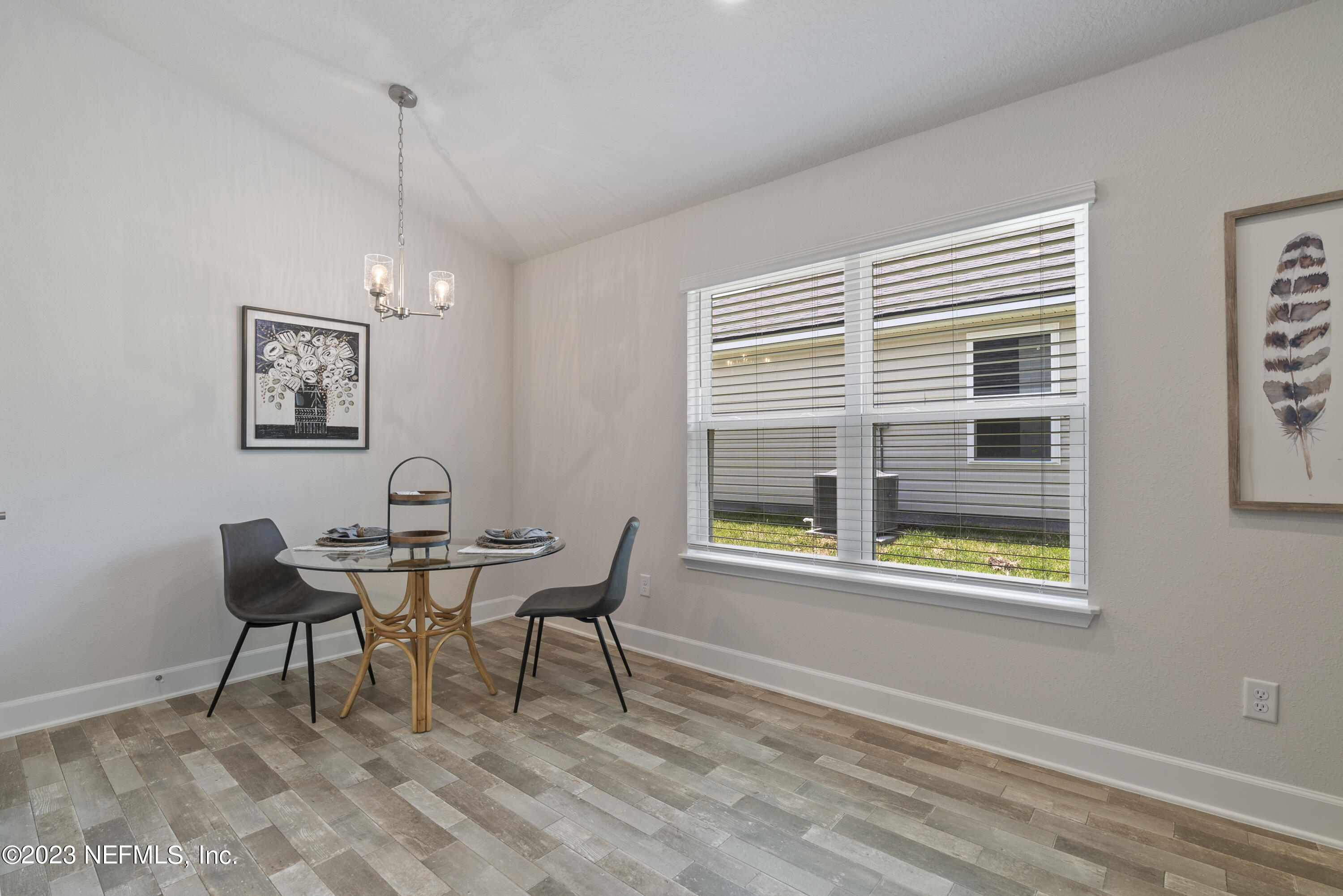7833 Driggers Street Jacksonville, FL 32220 - Photo 5 of 26 a dining room with furniture and window