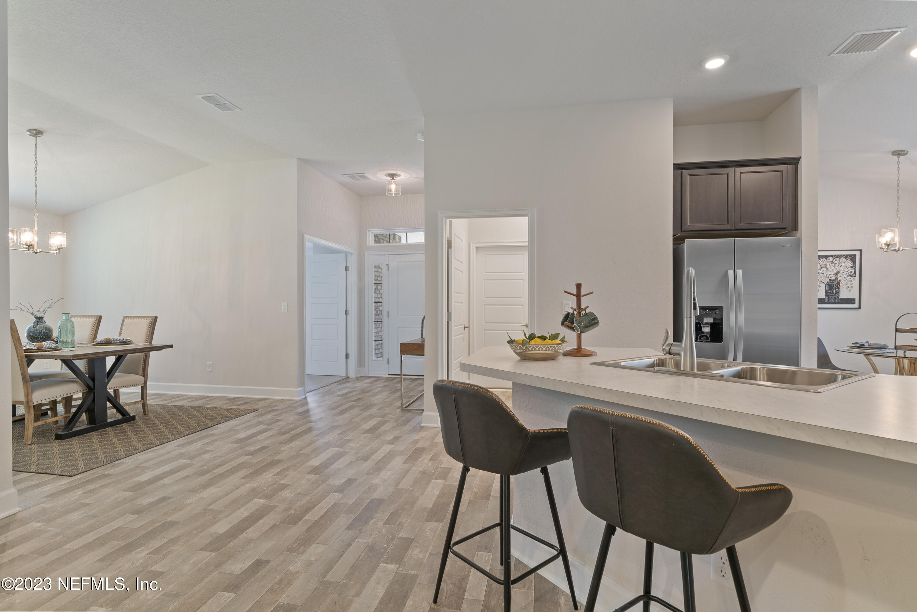 7833 Driggers Street Jacksonville, FL 32220 - Photo 9 of 26 a kitchen with a table and chairs in it