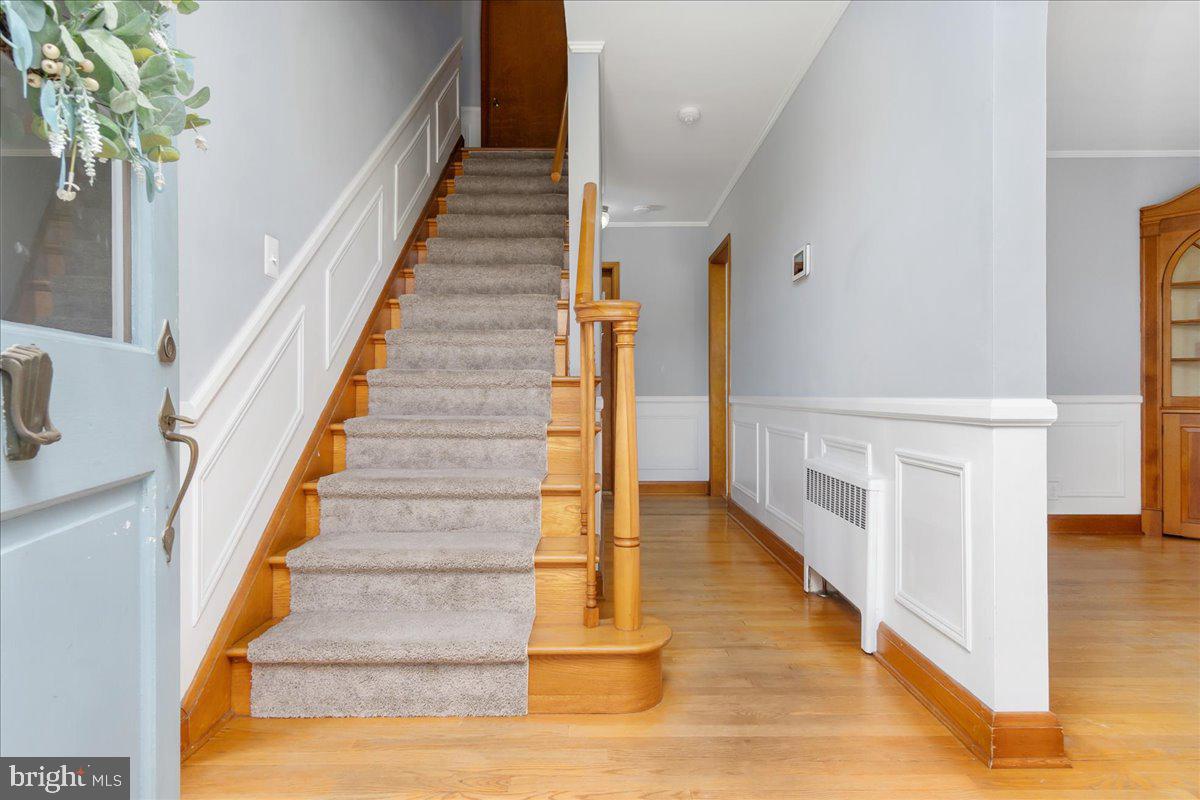 8466 Greenway Road Pasadena, MD 21122 - Photo 11 of 56 a view of entryway and hall with wooden floor