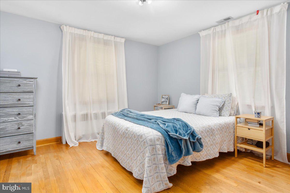 8466 Greenway Road Pasadena, MD 21122 - Photo 16 of 56 a bedroom with a bed and a window