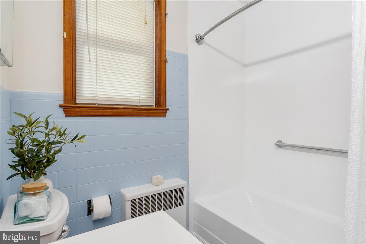 8466 Greenway Road Pasadena, MD 21122 - Photo 19 of 56 a bath room with a toilet