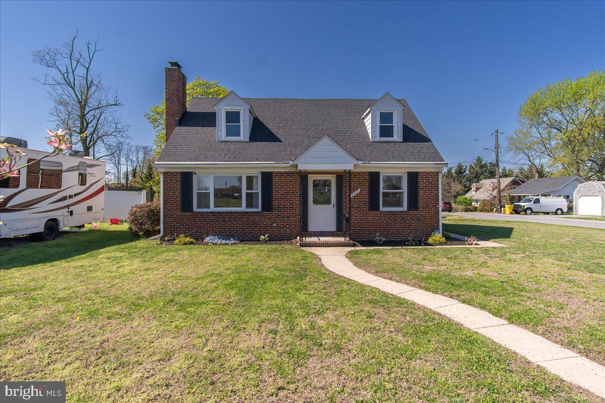 8466 Greenway Road Pasadena, MD 21122 - Photo 2 of 56 a front view of a house with a yard