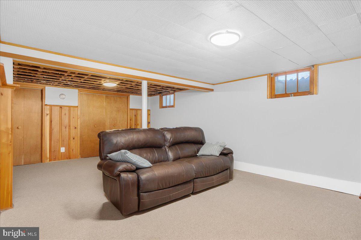 8466 Greenway Road Pasadena, MD 21122 - Photo 26 of 56 a living room with furniture and a ceiling fan
