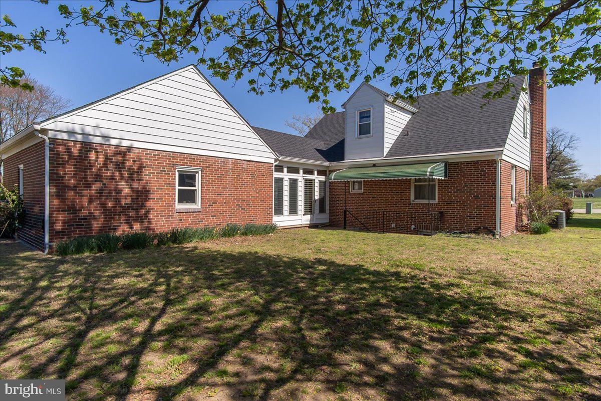 8466 Greenway Road Pasadena, MD 21122 - Photo 36 of 56 front view of a house with a yard