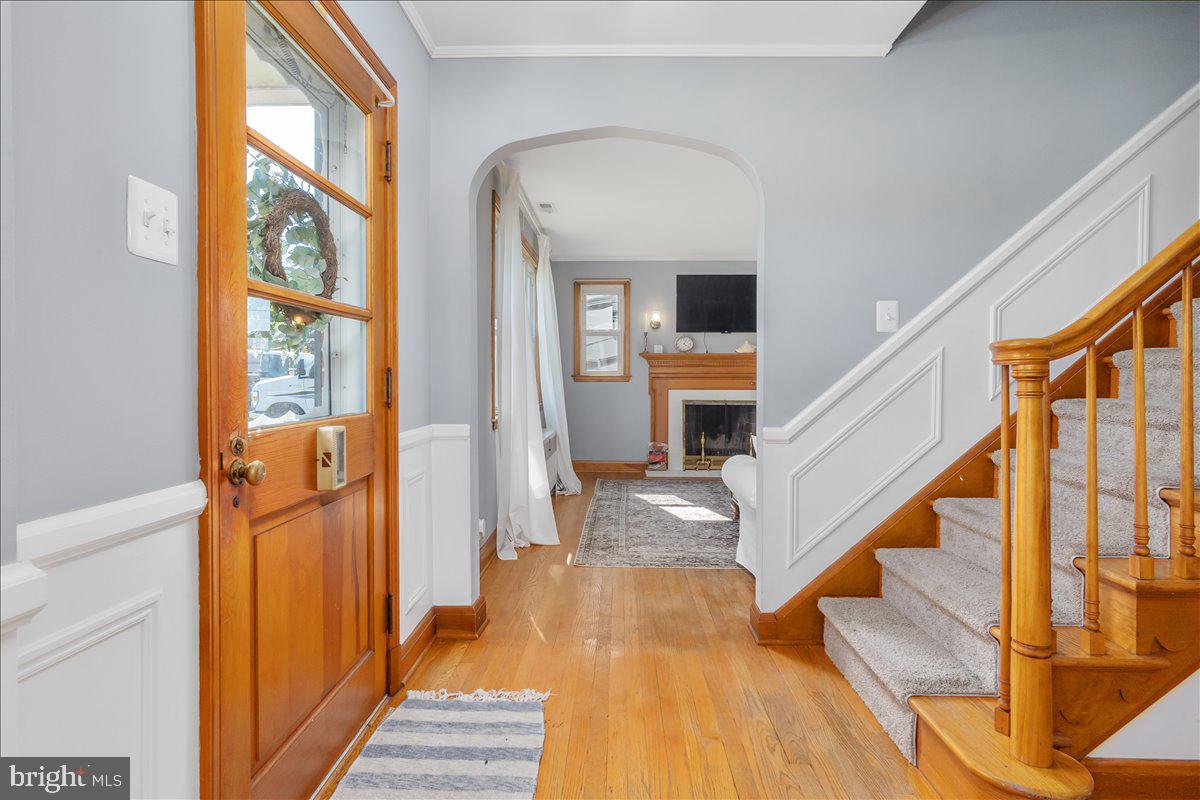 8466 Greenway Road Pasadena, MD 21122 - Photo 9 of 56 a view of an entryway with wooden floor and a livingroom view