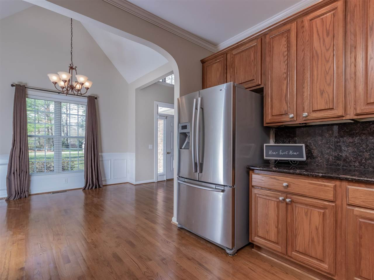 2864 Anfield Road Raleigh, NC 27606 - Photo 5 of 30 Large kitchen with abundant cabinets, pull outs, Stainless steel refrigerator conveys and granite counters! Kitchen