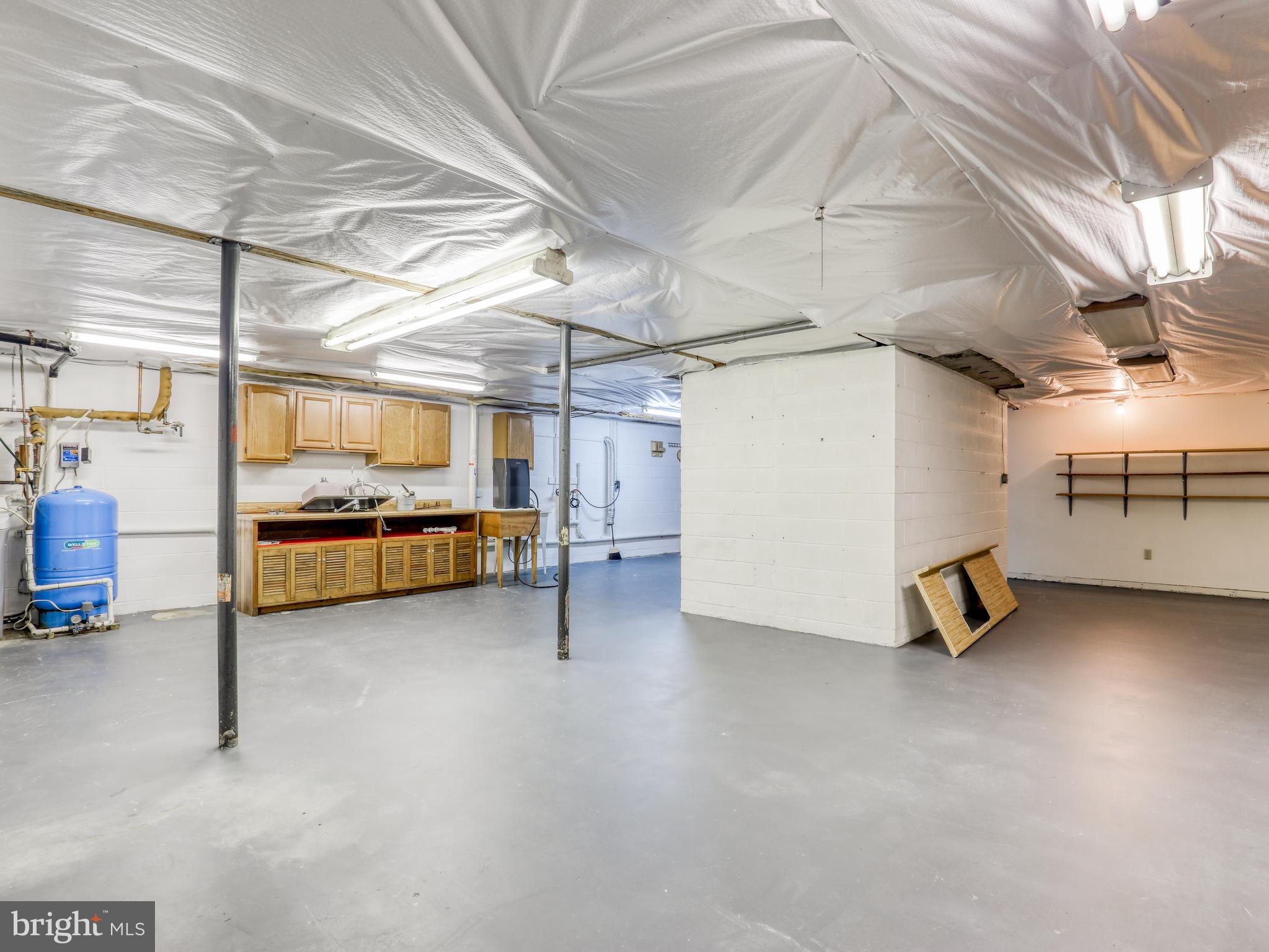 163 Old Forest Circle Winchester, VA 22602 - Photo 36 of 41 Basement work and storage area
