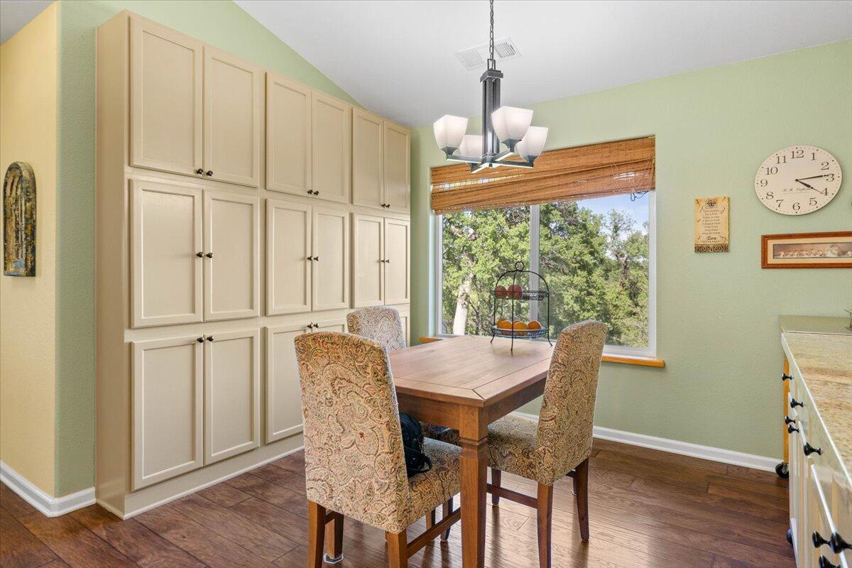 20410 Mallorca Lane Red Bluff, CA 96080 - Photo 11 of 37 a view of a dining room with furniture window and wooden floor