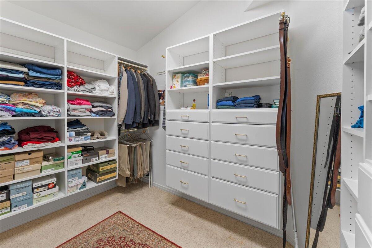 20410 Mallorca Lane Red Bluff, CA 96080 - Photo 14 of 37 a view of walk in closet with clothes and shoes