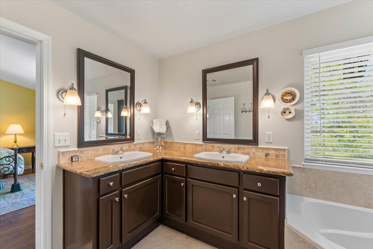 20410 Mallorca Lane Red Bluff, CA 96080 - Photo 15 of 37 a bathroom with a granite countertop sink and a mirror