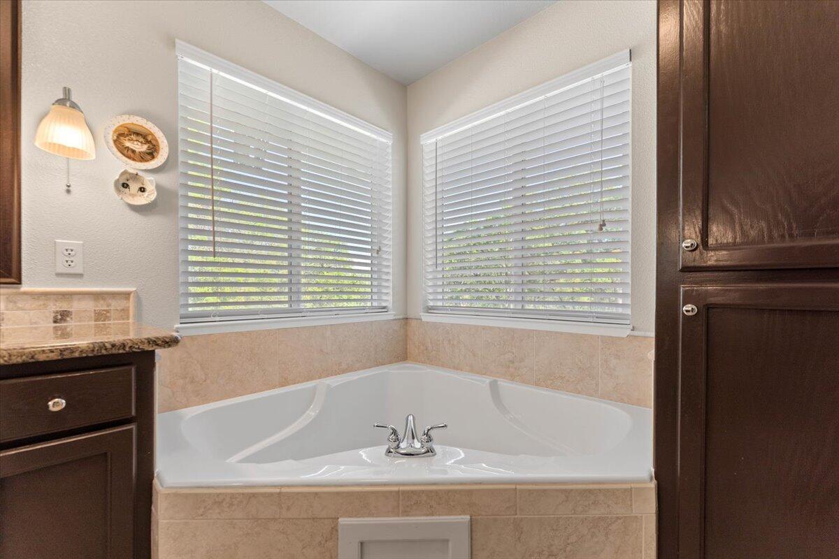 20410 Mallorca Lane Red Bluff, CA 96080 - Photo 16 of 37 a bathroom with a bathtub and a sink