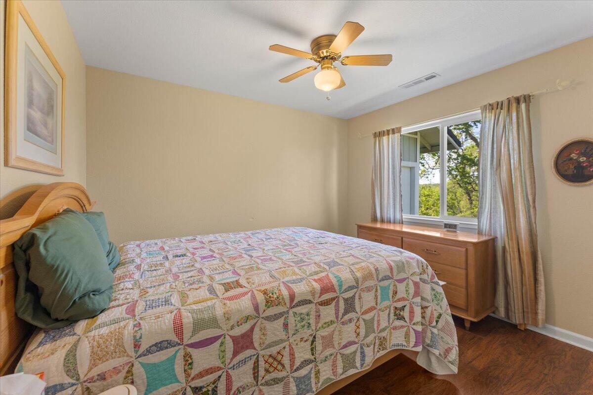 20410 Mallorca Lane Red Bluff, CA 96080 - Photo 18 of 37 a bedroom with a bed and a window